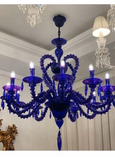 a blue chandelier hanging from the ceiling