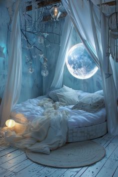 a bed with white sheets and drapes in a room that looks like a moon