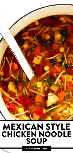 mexican style chicken noodle soup in a white bowl with a spoon on the side