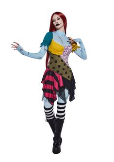 a woman dressed up as a zombie with long red hair and blue skin wearing black boots