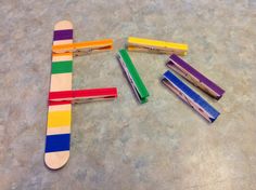 several colored toothbrushes laid out on the floor