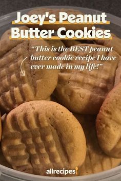 a bowl filled with peanut butter cookies on top of a counter