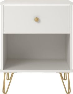 a white nightstand with gold handles on the top and bottom drawer, against a white background