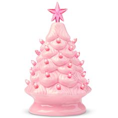 a pink ceramic christmas tree with stars on top