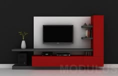 an entertainment center with a flat screen tv mounted on it's side, in front of a black wall