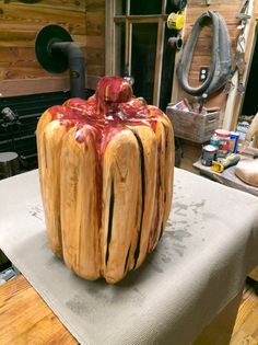 a large wooden sculpture sitting on top of a table