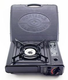 the portable stove is black and has two burners