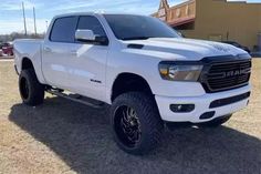 a white truck parked in front of a building