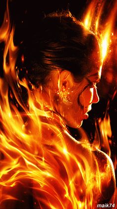 a woman in flames with her mouth open