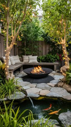 an outdoor fire pit surrounded by plants and trees