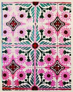 a pink and green tile with flowers on it