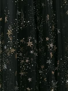 black sheer fabric with gold stars and sequins