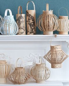 decorative paper lanterns are lined up on a mantel