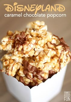 caramel chocolate popcorn in a white bowl with the title disney land on it's side