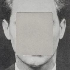 a black and white photo of a man's face with a square in the middle