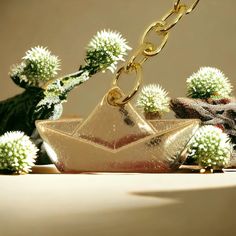 a star shaped object sitting on top of a table next to cactuses and other items