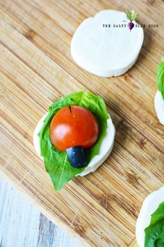 small appetizers with lettuce and tomatoes on them