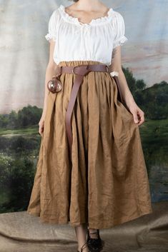 This skirt is made from a beautiful shade of ginger brown 100% linen fabric that is soft, breathable and drapey. Linen is the historically accurate choice for historical costumes, and this will add a level of authenticity to your outfit.  An elastic waistband gives the skirt a comfortable fit around your natural waist. This skirt features and elastic waistband for a comfortable fit around your waist. The length is made custom to any length you’d like. Please provide your natural waist meas Linen Midi Skirt, Ginger Brown, Character Reference, Historical Costume, Linen Skirt, Corsets, Linen Fabric, Ginger, Midi Skirt