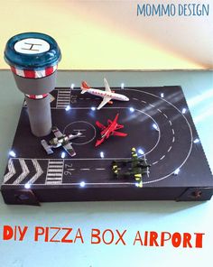 a box with some toy airplanes on it and the words diy pizza box airport