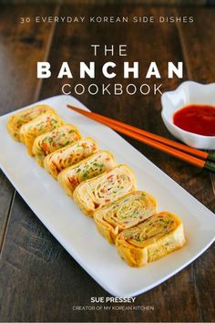 the banchan cookbook by sue pressey is on display with chopsticks