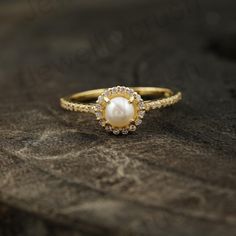 Vintage Inspired Pearl & Diamond Ring, Dainty Engagement Ring, Freshwater Pearl Ring, 10K Solid Gold Ring For Women, June Birthstone Gift Main Stone: Pearl Main Stone Color: White  Main Stone Shape: Round  Birth Month: June Secondary Stone - CZ Diamond Stone Shape - Round Stone Color - Colorless S I L V E R J E W E L R Y C A R E Silver is not the best friend of oxygen and sulfur; it can be oxidized and tarnished from time to time it is the nature of silver. To keep the silver shiny and prevent i Pearl Diamond Ring, Dainty Engagement Ring, Gold Ring For Women, Dainty Engagement, Dainty Engagement Rings, Freshwater Pearl Ring, Pearl And Diamond Ring, Fancy Gifts, Solid Gold Ring