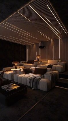 a dimly lit living room with couches and lamps on the ceiling, along with other furniture