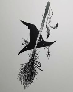 an ink drawing of a witch's hat and broom