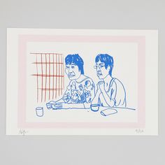 two people sitting at a table in front of a window with blue ink on paper