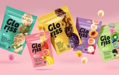 three bags of glo - riss candy are shown in front of a pink background