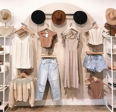 clothes and hats on display in a clothing store