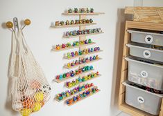 the toy storage area is organized with wooden pegs