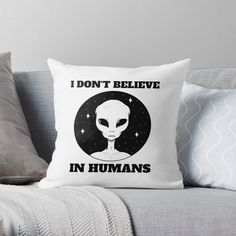 an alien with the words i don't believe in humans on it throw pillow