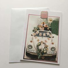 a wedding card with an old vw bus decorated for the bride and groom on their wedding day