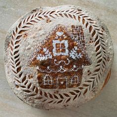 a close up of a piece of bread with a house on it