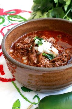 a close up of a bowl of food on a table