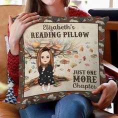 a woman holding up a pillow that reads elizabeth's reading pillow just one more chapter