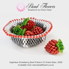 a bowl with strawberries in it sitting next to another bowl that is made out of beads