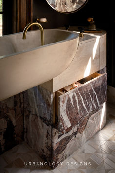 a marble sink and mirror in a bathroom