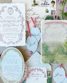 wedding stationery with flowers and stamps on them