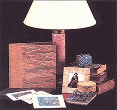 a lamp and some books on a table