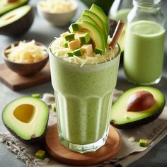 an avocado smoothie is garnished with fresh fruit