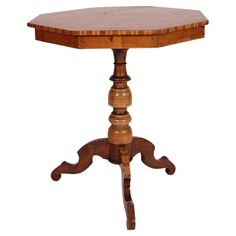 a small wooden table with an oval top