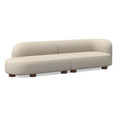 a white couch sitting on top of a wooden table