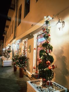 christmas decorations on the outside of a building