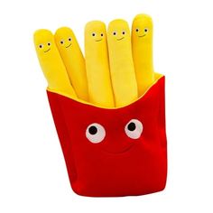 a red bag filled with lots of yellow sticks covered in googly eyes and smiling faces