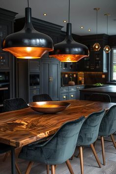 a wooden table surrounded by chairs and lights