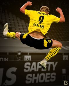 the soccer player is jumping in the air