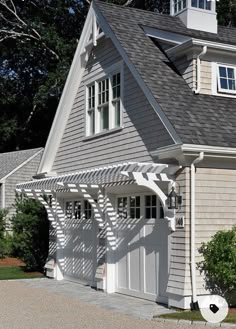 a house with an attached garage and white shutters