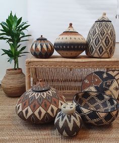 baskets and vases are arranged on the floor