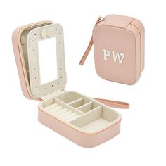 a pink jewelry case with compartments and zippers on the inside is open to show it's contents